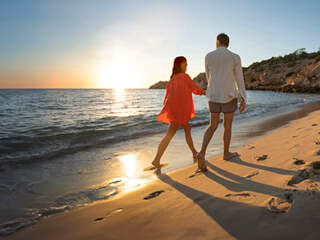 Couple walking on the beach